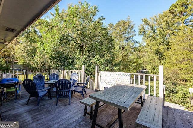 wooden terrace featuring area for grilling