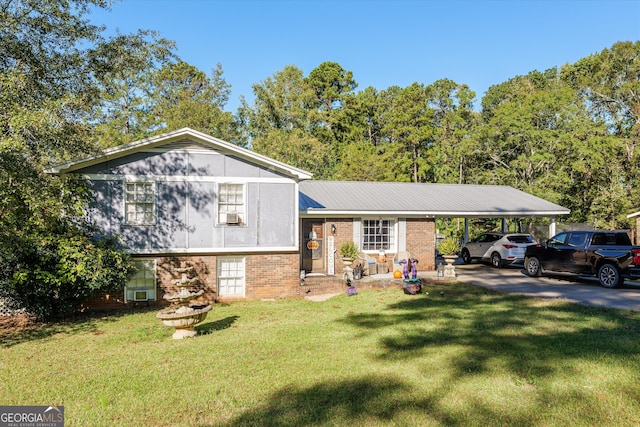 split level home featuring a front lawn and a carport