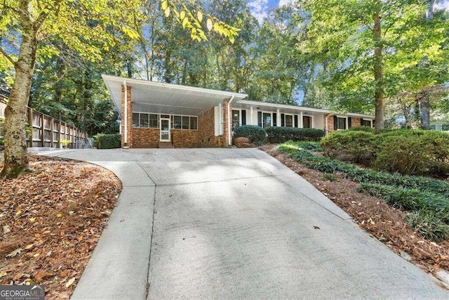 single story home with a carport