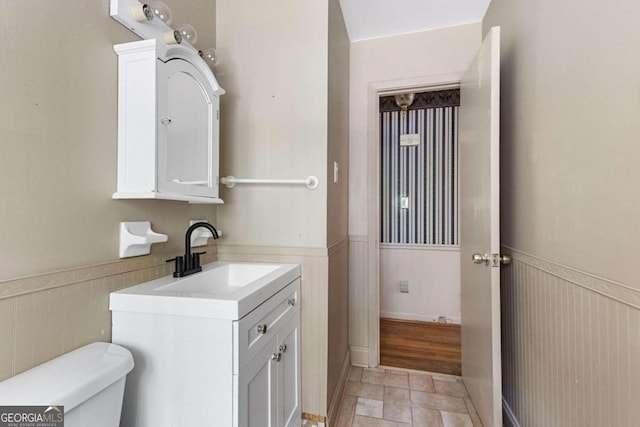 bathroom with toilet and vanity