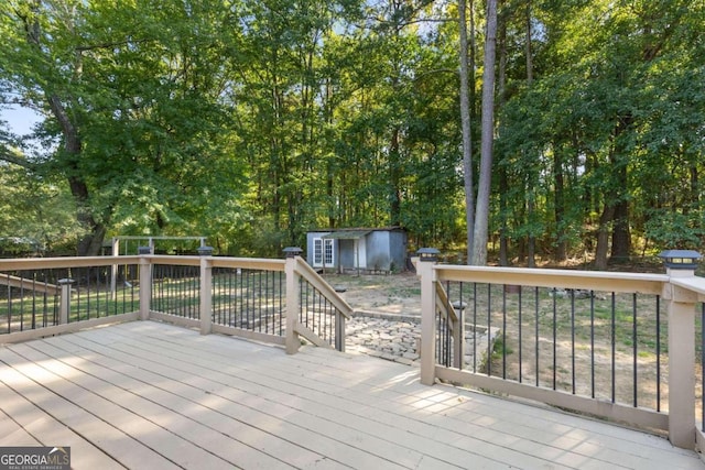 wooden deck with a storage shed