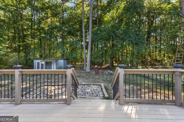 wooden deck with a shed