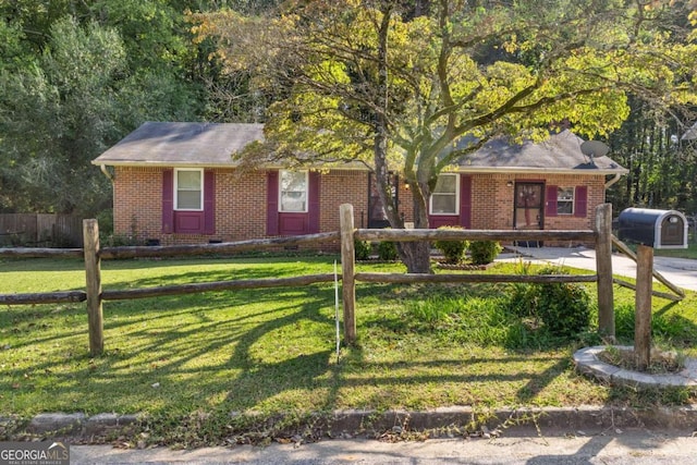 single story home featuring a front yard