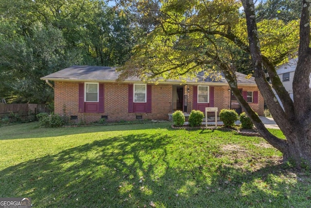 ranch-style home featuring a front yard