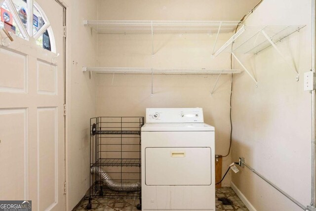 washroom with washer / clothes dryer