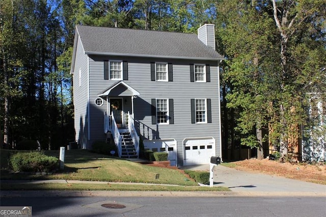 view of front facade featuring a front lawn and a garage