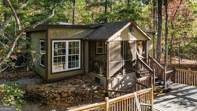 view of outdoor structure with a sunroom