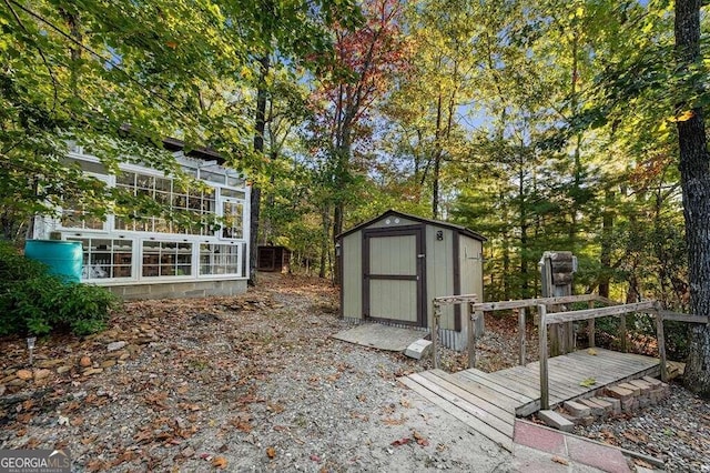 deck featuring a storage shed