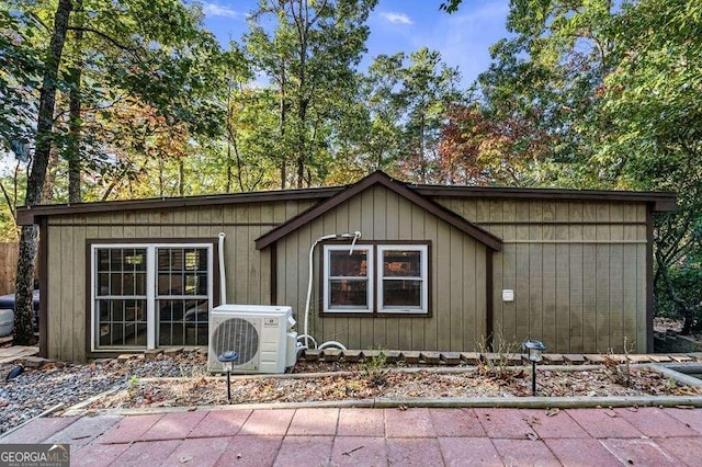 view of front of home featuring ac unit