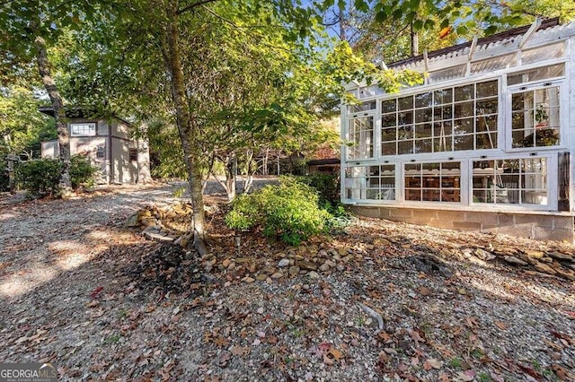 view of yard with a sunroom