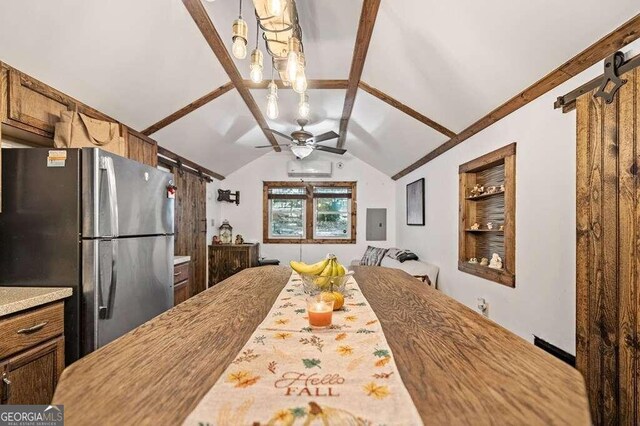 kitchen with lofted ceiling with beams, built in features, electric panel, stainless steel refrigerator, and ceiling fan