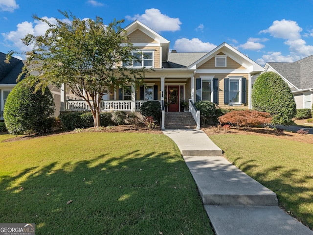 craftsman-style house featuring a front yard and a porch