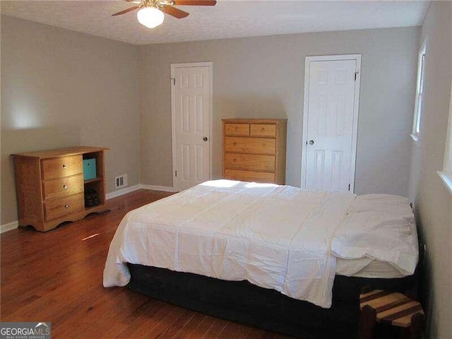 bedroom featuring dark wood-type flooring and ceiling fan