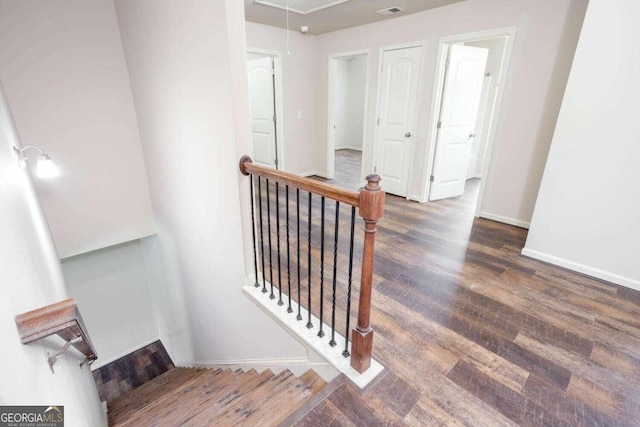 stairs with hardwood / wood-style flooring