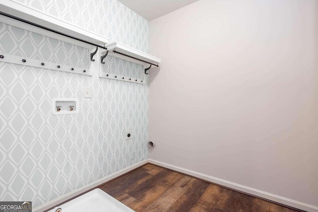 clothes washing area featuring electric dryer hookup, washer hookup, and dark hardwood / wood-style flooring