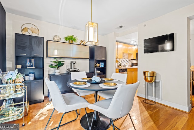 dining area with light wood-type flooring