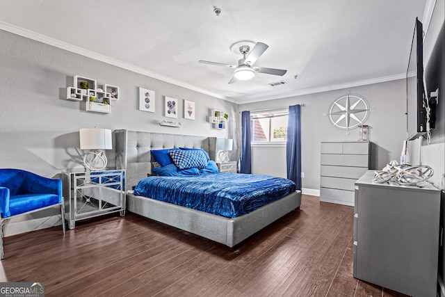 bedroom featuring dark wood-type flooring, ceiling fan, and ornamental molding