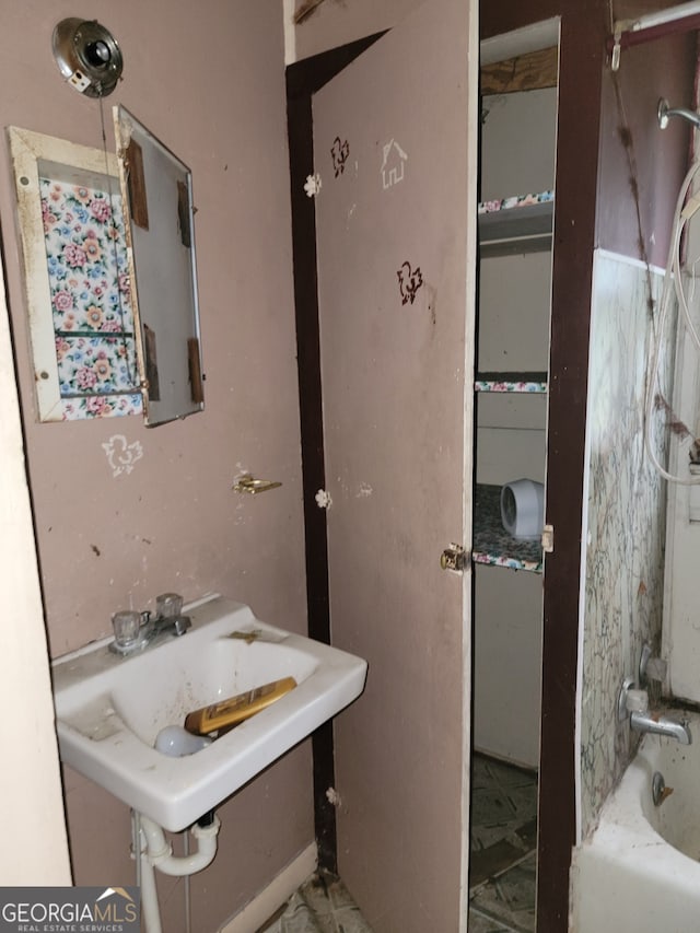 bathroom featuring sink and shower / washtub combination