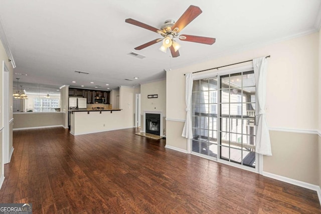 unfurnished living room featuring ornamental molding, ceiling fan, and dark hardwood / wood-style flooring