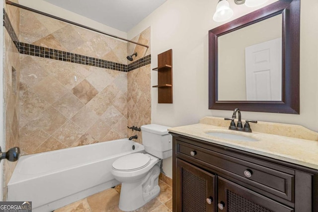 full bathroom with vanity, toilet, and tiled shower / bath combo