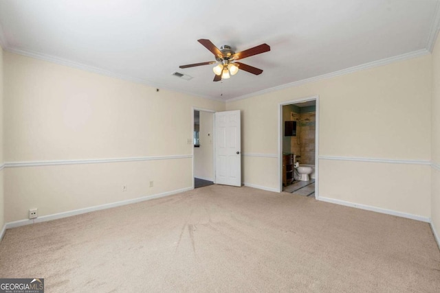 empty room featuring ornamental molding, light colored carpet, and ceiling fan