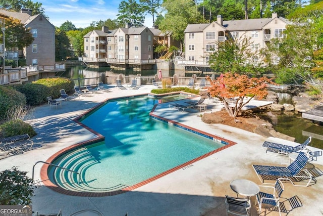 view of swimming pool with a patio area