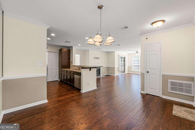 kitchen with a breakfast bar area, dark wood-type flooring, crown molding, sink, and stainless steel dishwasher