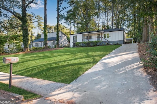 view of front of house with a front yard and a porch