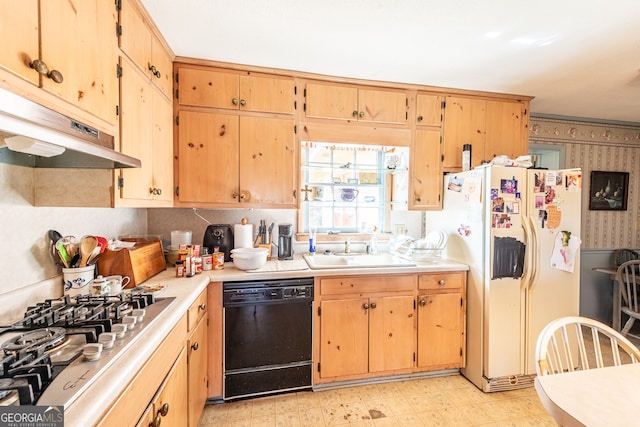 kitchen featuring stainless steel gas cooktop, dishwasher, sink, and white refrigerator with ice dispenser