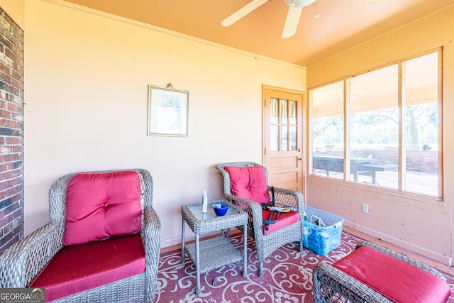 sunroom featuring ceiling fan