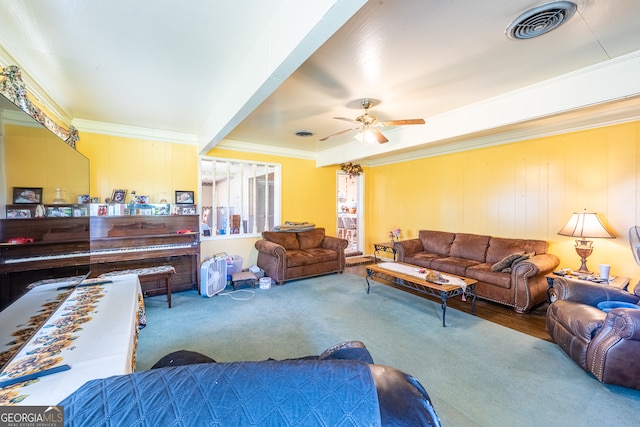 living room featuring ornamental molding, carpet floors, and ceiling fan