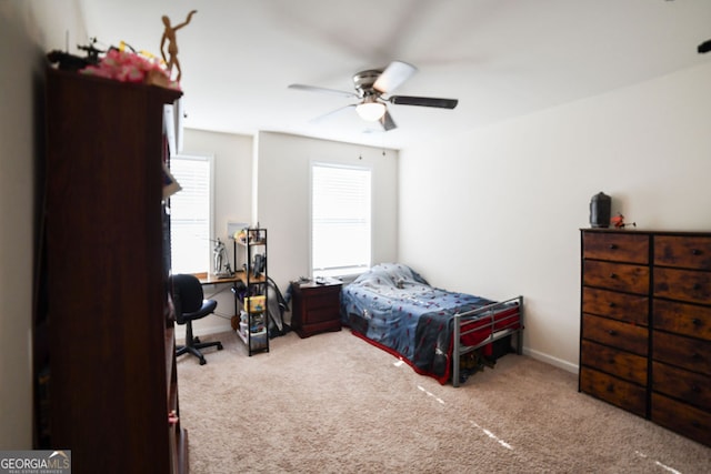 carpeted bedroom with ceiling fan