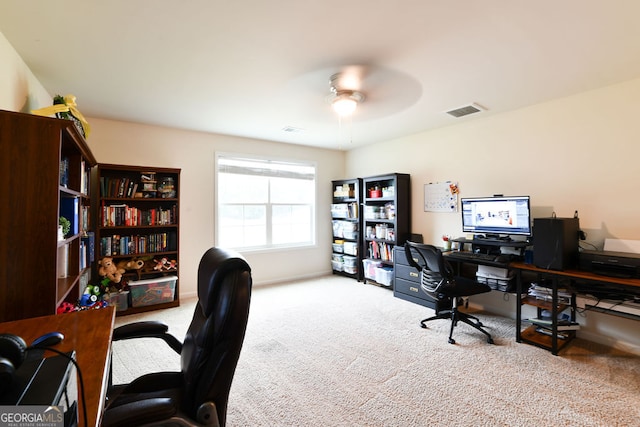 office space featuring carpet and ceiling fan