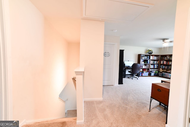 hallway featuring light carpet