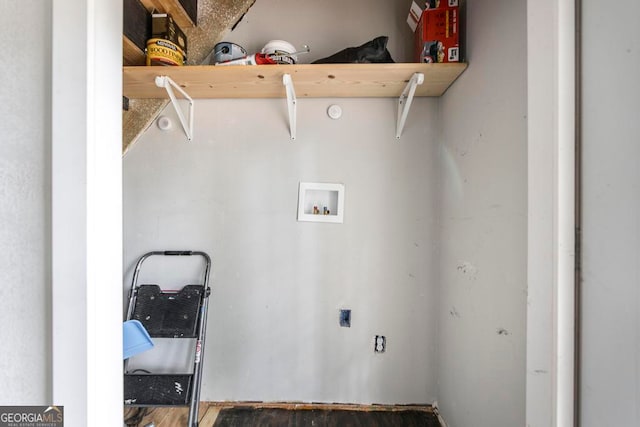 clothes washing area with washer hookup and dark wood-type flooring