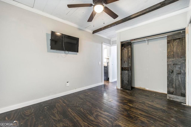 unfurnished bedroom with beamed ceiling, ornamental molding, dark wood-type flooring, and ceiling fan