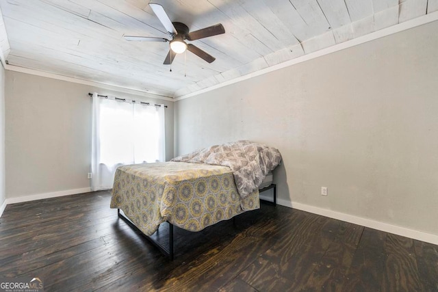 bedroom featuring dark hardwood / wood-style flooring, crown molding, wooden ceiling, and ceiling fan