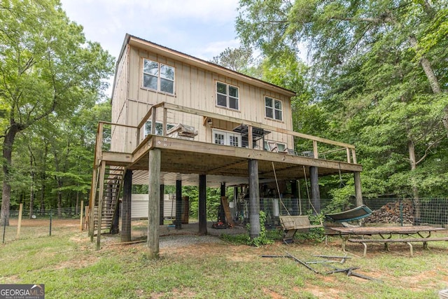 back of house with a wooden deck