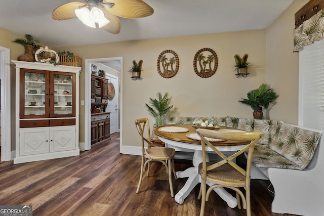 dining area with dark wood-type flooring