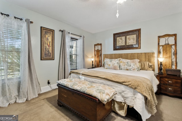 bedroom featuring light colored carpet