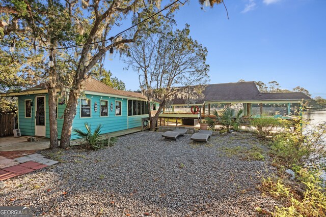 back of property featuring a deck