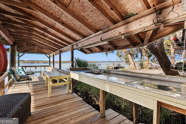 view of dock with a water view and sink