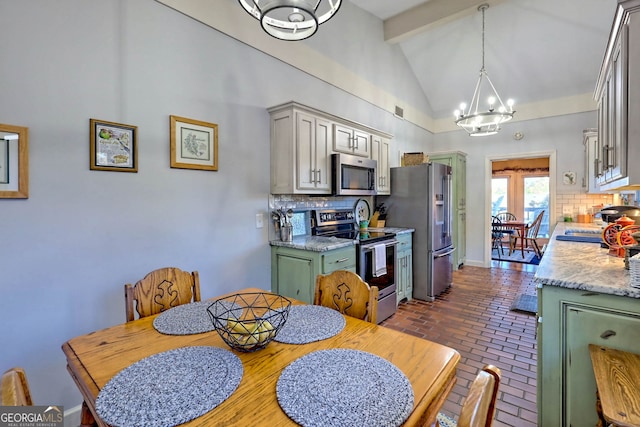 dining area featuring high vaulted ceiling, beamed ceiling, and an inviting chandelier