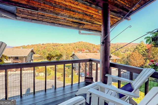 wooden deck featuring a mountain view