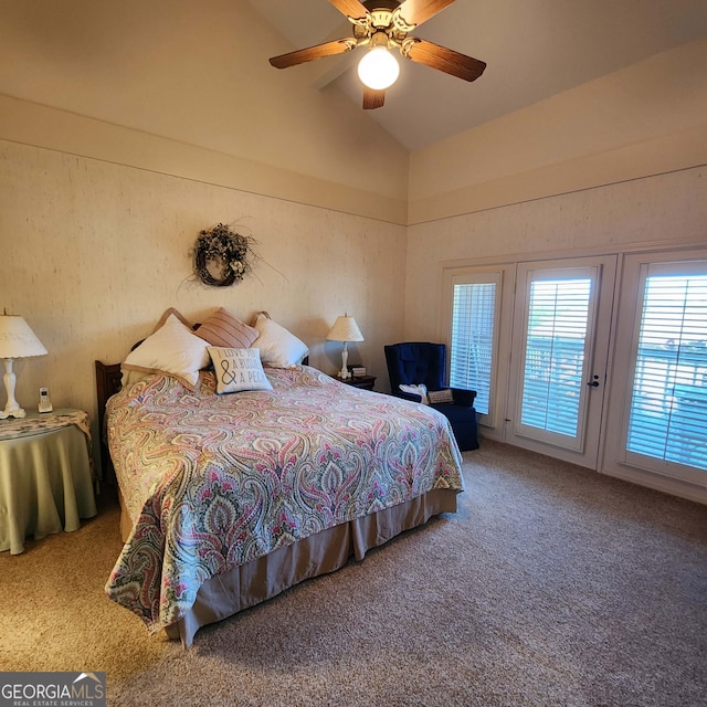 carpeted bedroom featuring lofted ceiling and ceiling fan