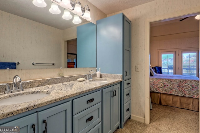 bathroom featuring vanity and a textured ceiling