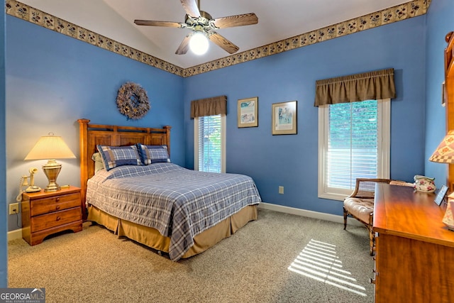 bedroom with ceiling fan, carpet, and multiple windows