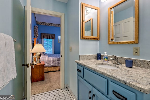 bathroom with vanity and tile patterned flooring