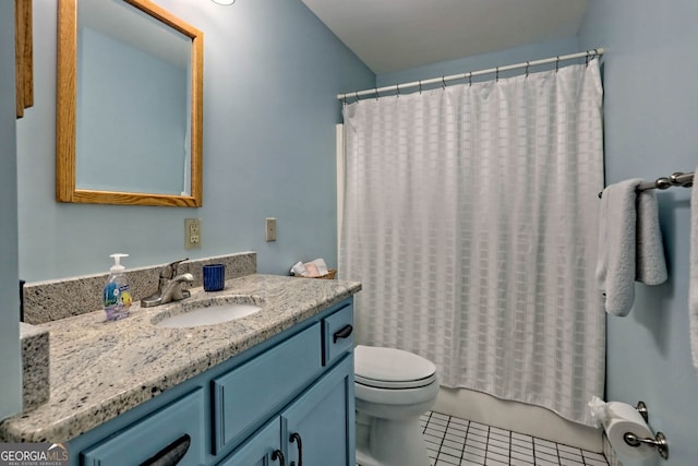 full bathroom with vanity, toilet, tile patterned floors, and shower / bath combo with shower curtain