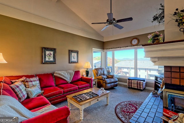 living room featuring ceiling fan, carpet flooring, and vaulted ceiling